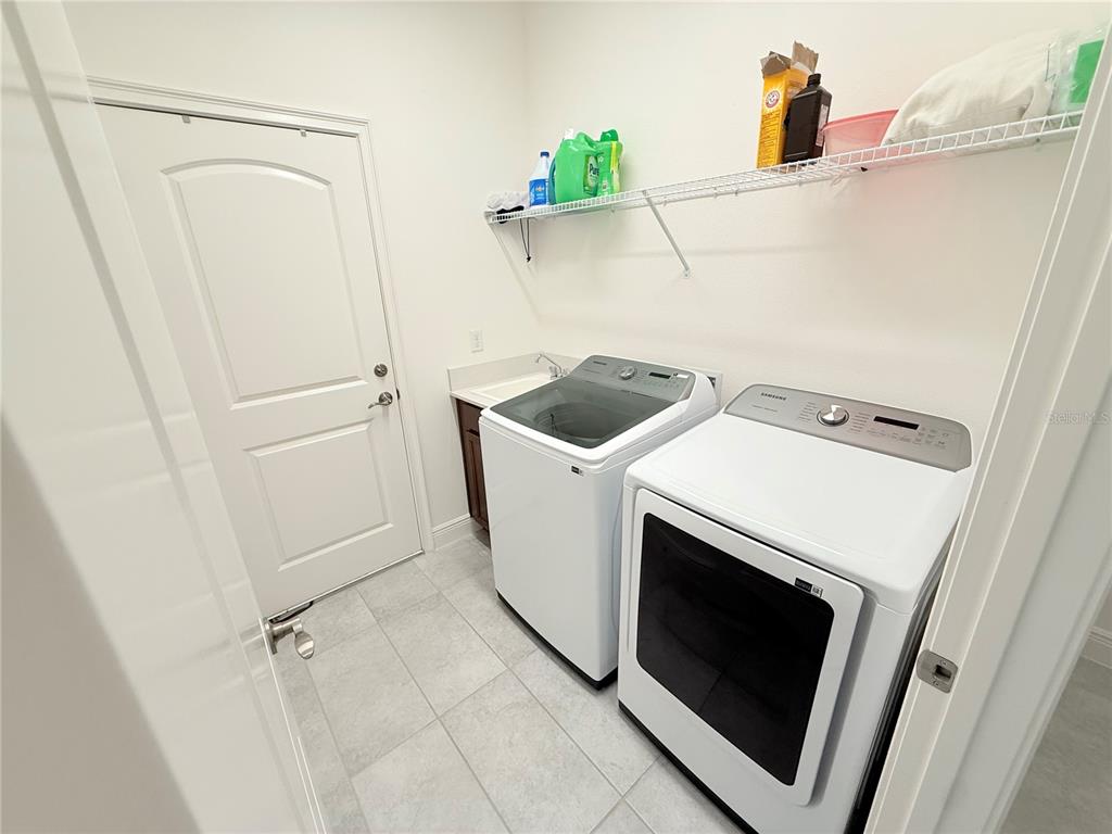 3112 Oxbow Court Harmony, FL 34773 - Photo 17 of 22 a utility room with dryer and washer
