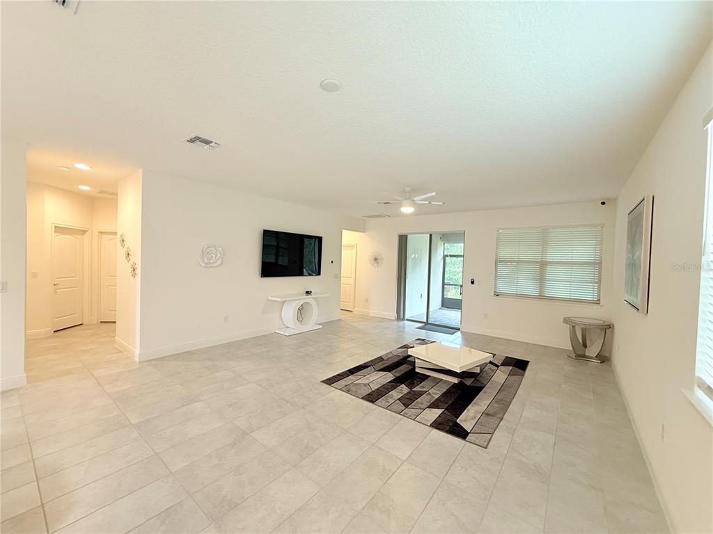 3112 Oxbow Court Harmony, FL 34773 - Photo 5 of 22 a living room with furniture and a flat screen tv