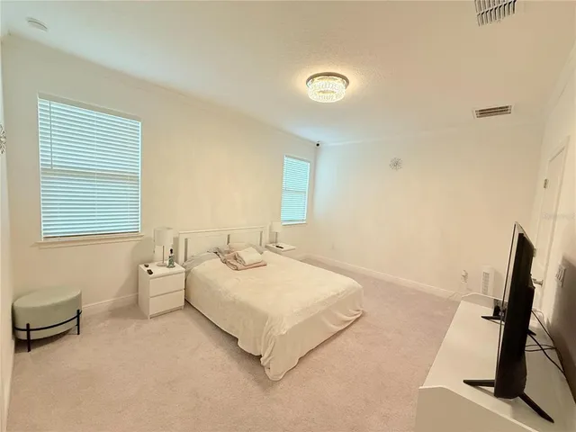 a room with a bed and a desk