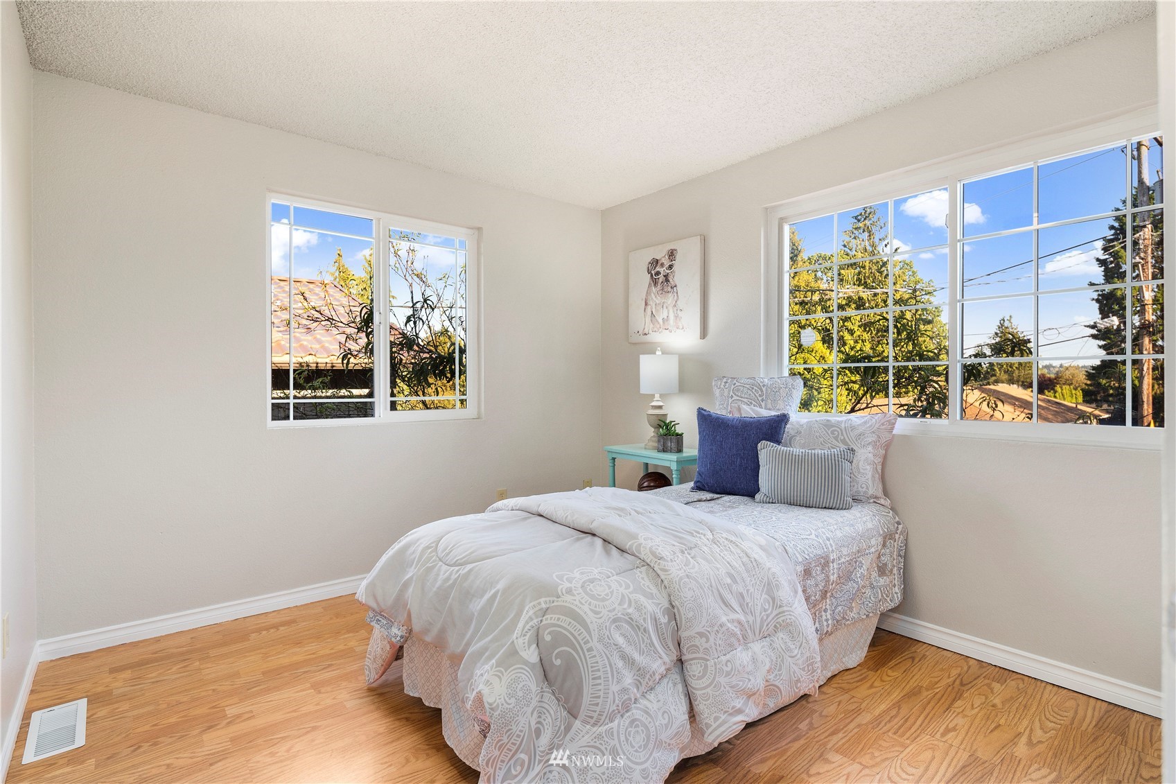 4800 South Frontenac Street Seattle, WA 98118 - Photo 20 of 40 a bedroom with a bed and a window