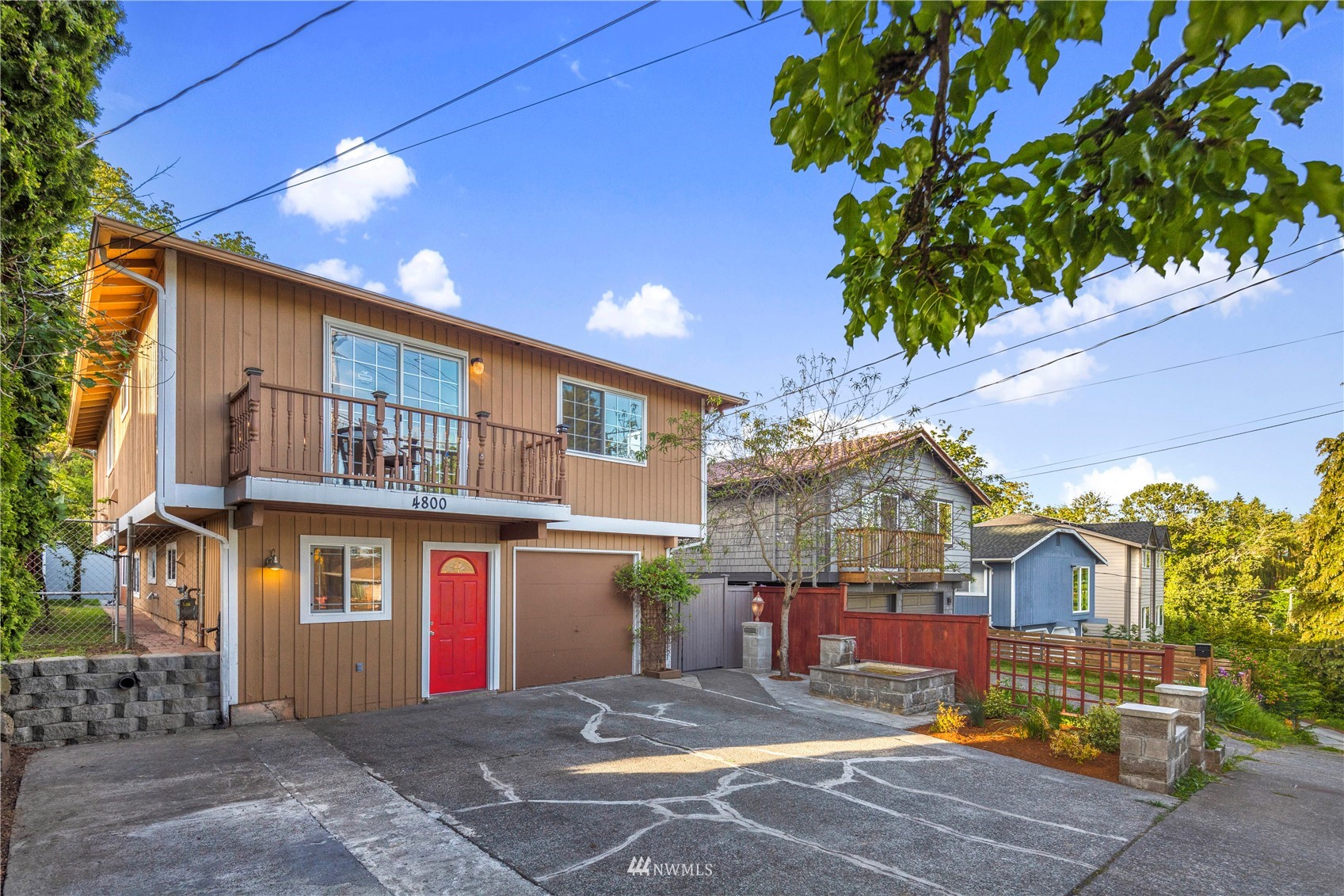 4800 South Frontenac Street Seattle, WA 98118 - Photo 2 of 40 a front view of a building with garden