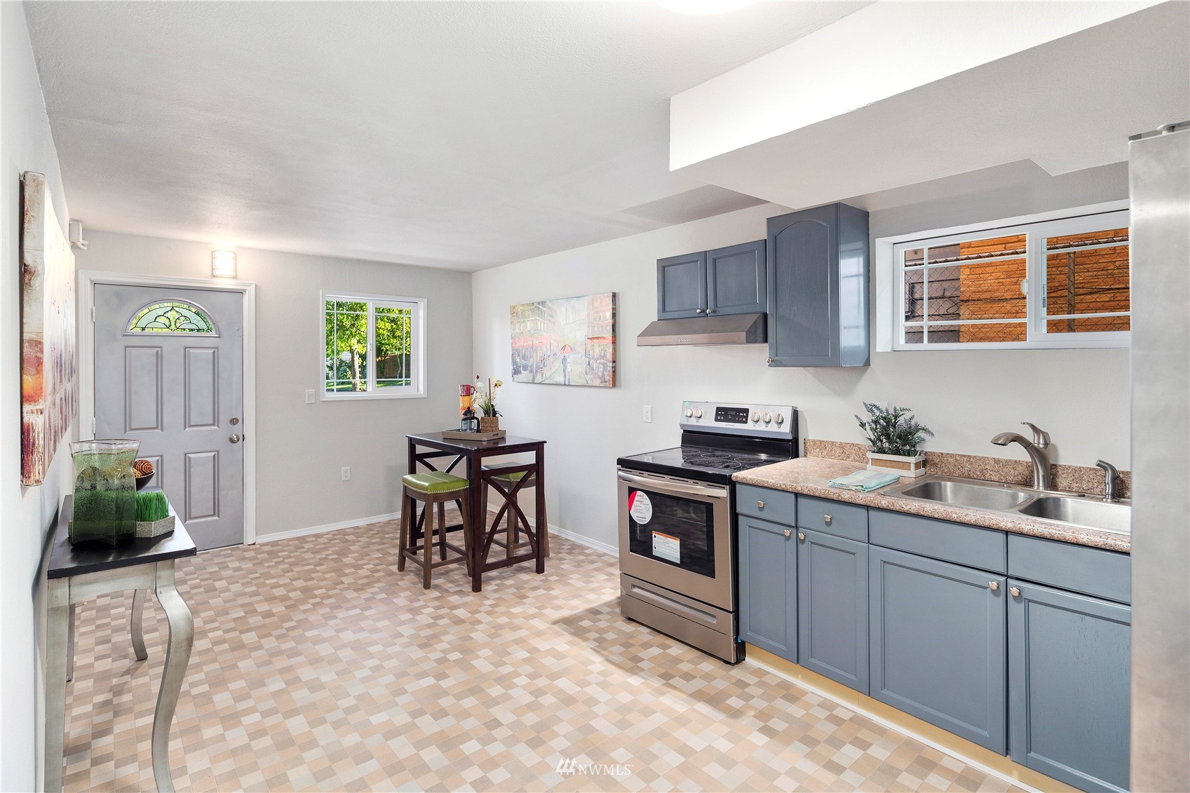 4800 South Frontenac Street Seattle, WA 98118 - Photo 23 of 40 a kitchen with a sink and cabinets