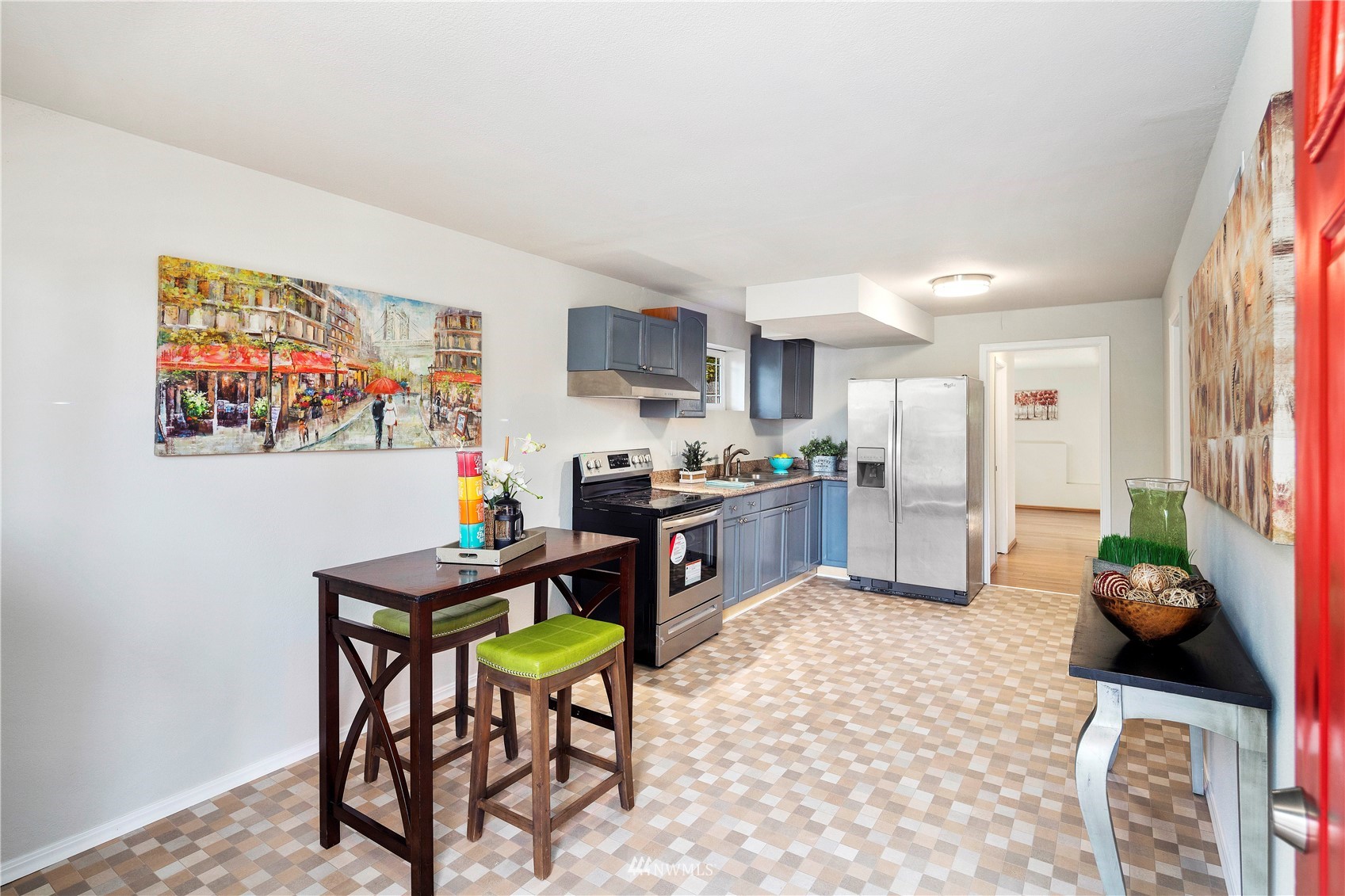 4800 South Frontenac Street Seattle, WA 98118 - Photo 25 of 40 a kitchen with stainless steel appliances granite countertop a refrigerator and a stove top oven