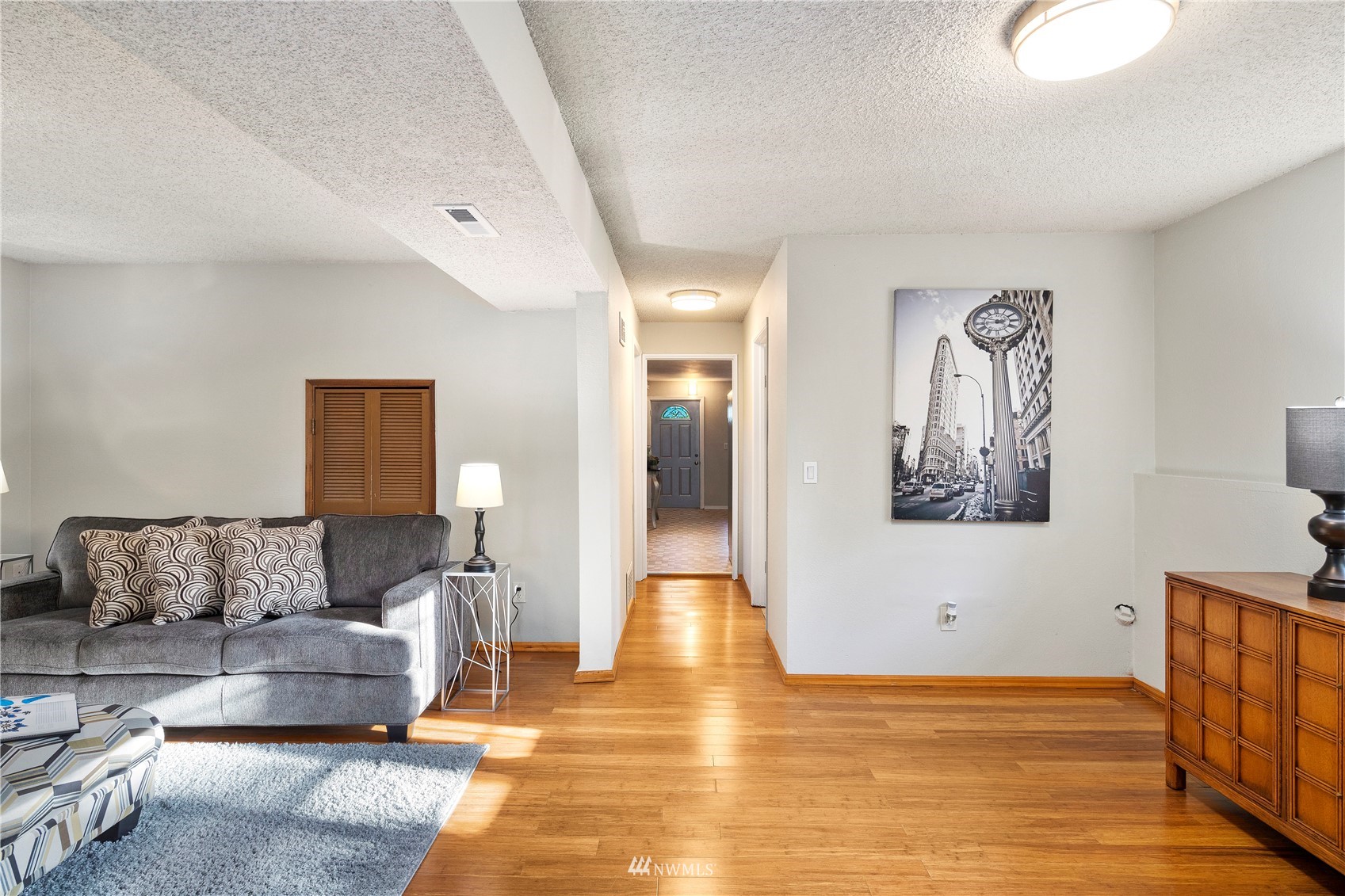 4800 South Frontenac Street Seattle, WA 98118 - Photo 29 of 40 a living room with furniture and wooden floor