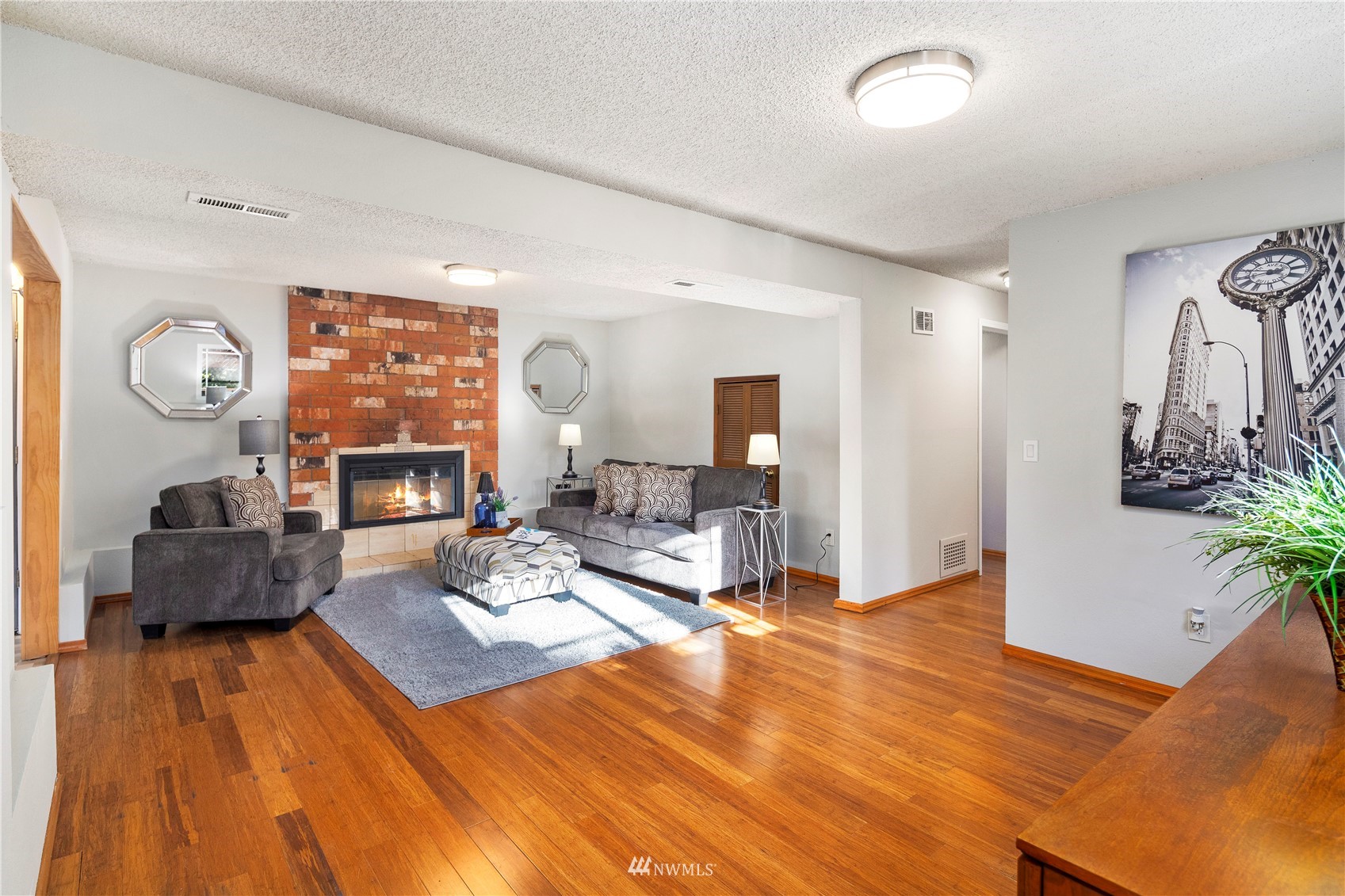 4800 South Frontenac Street Seattle, WA 98118 - Photo 30 of 40 a living room with furniture and a fireplace