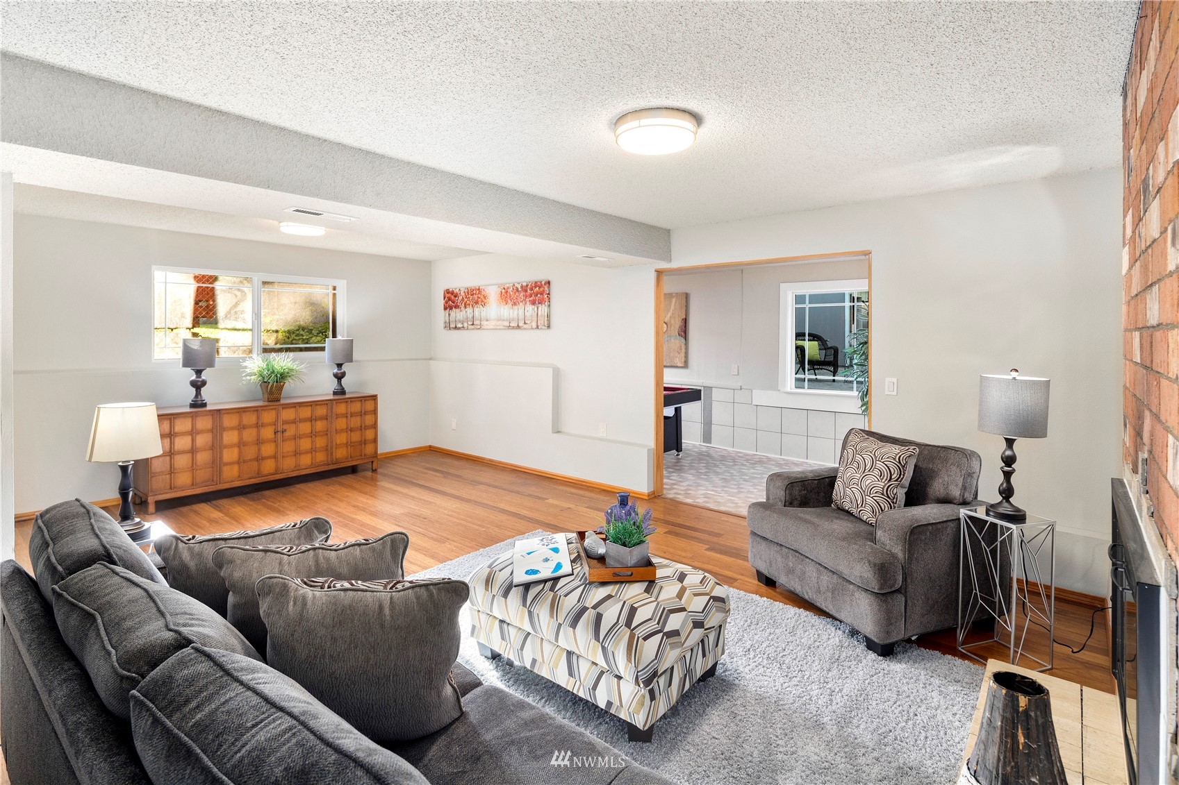 4800 South Frontenac Street Seattle, WA 98118 - Photo 32 of 40 a living room with furniture and a couch