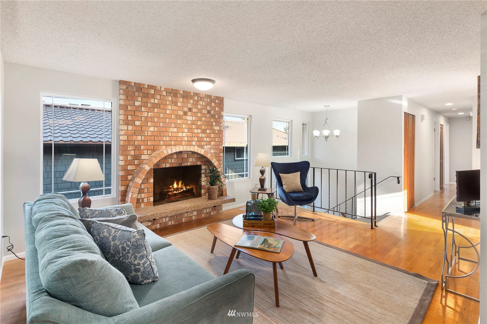 4800 South Frontenac Street Seattle, WA 98118 - Photo 5 of 40 a living room with furniture and a fireplace