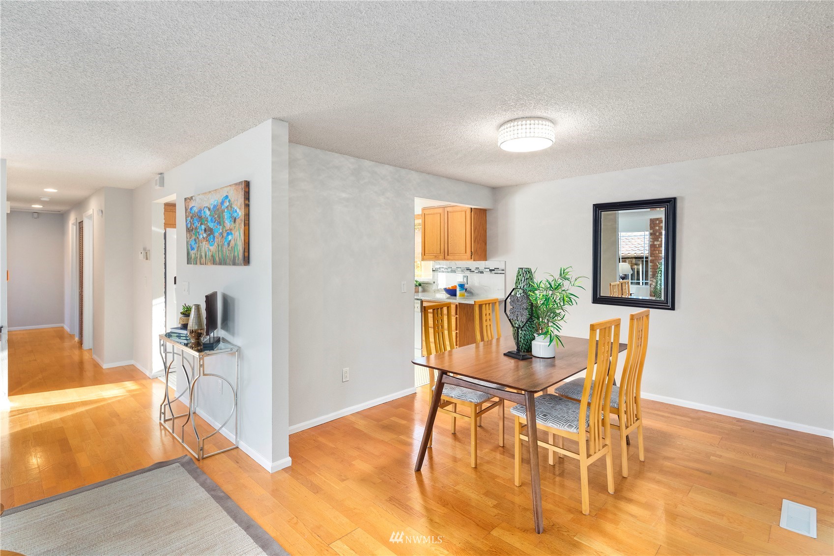 4800 South Frontenac Street Seattle, WA 98118 - Photo 9 of 40 a dining room with furniture and wooden floor