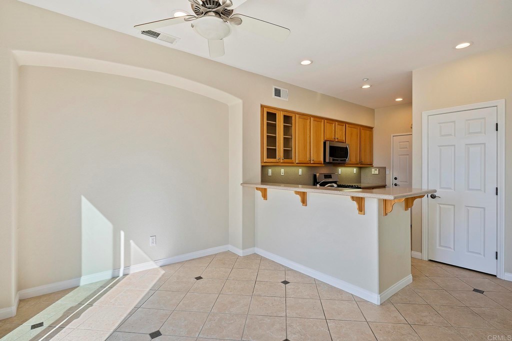 1295 Highbluff Avenue San Marcos, CA 92078 - Photo 12 of 38 a view of kitchen with stainless steel appliances a refrigerator and a sink