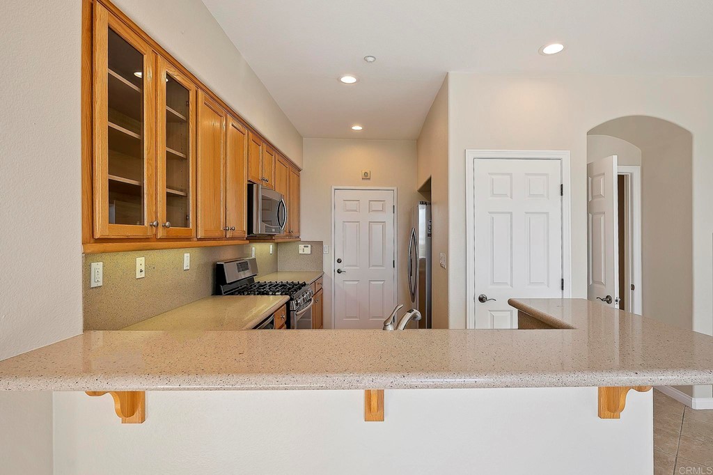 1295 Highbluff Avenue San Marcos, CA 92078 - Photo 13 of 38 a view of a living room and bathroom