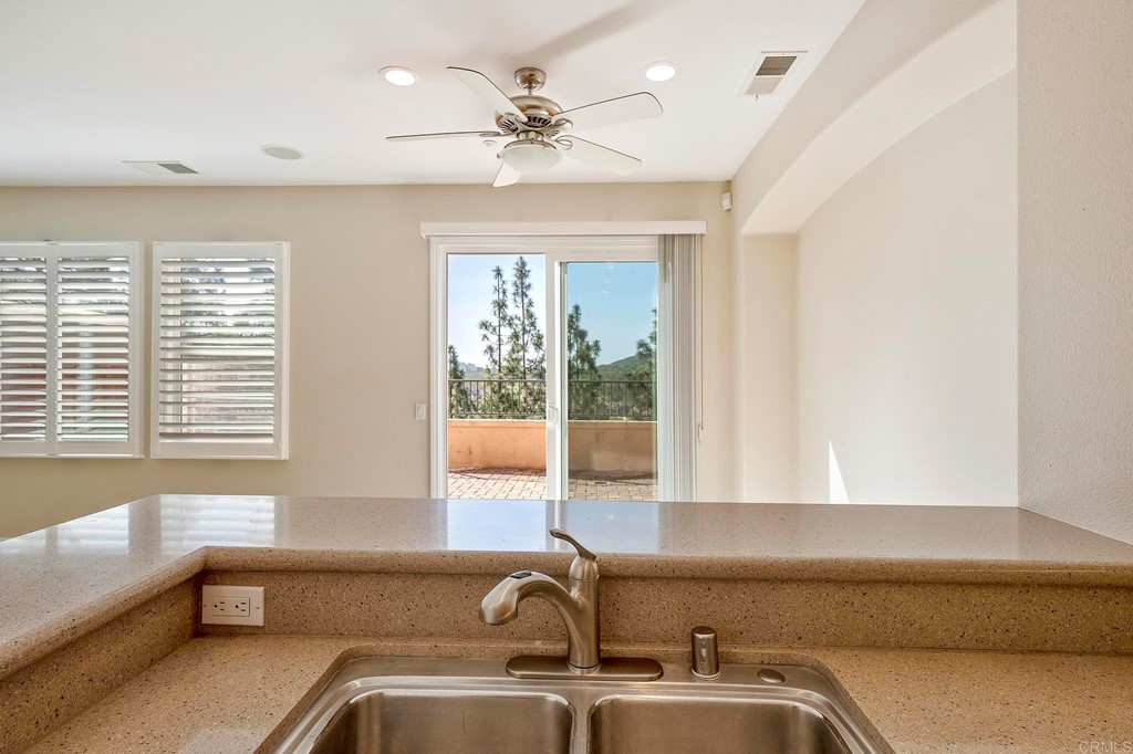 1295 Highbluff Avenue San Marcos, CA 92078 - Photo 15 of 38 a bathroom with a sink and a bathtub