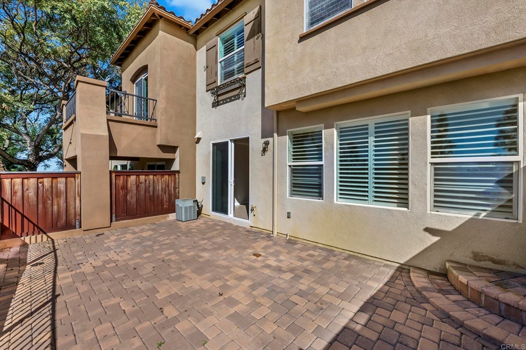 1295 Highbluff Avenue San Marcos, CA 92078 - Photo 29 of 38 a view of backyard with large trees and wooden fence