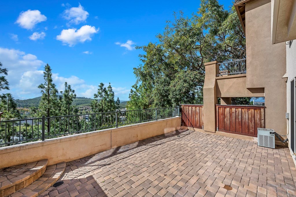 1295 Highbluff Avenue San Marcos, CA 92078 - Photo 3 of 38 a view of balcony with wooden floor and fence