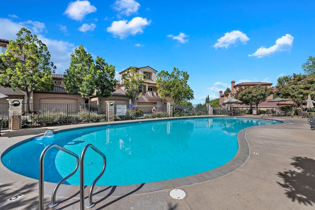 1295 Highbluff Avenue San Marcos, CA 92078 - Photo 34 of 38 a view of a swimming pool with a table and chairs