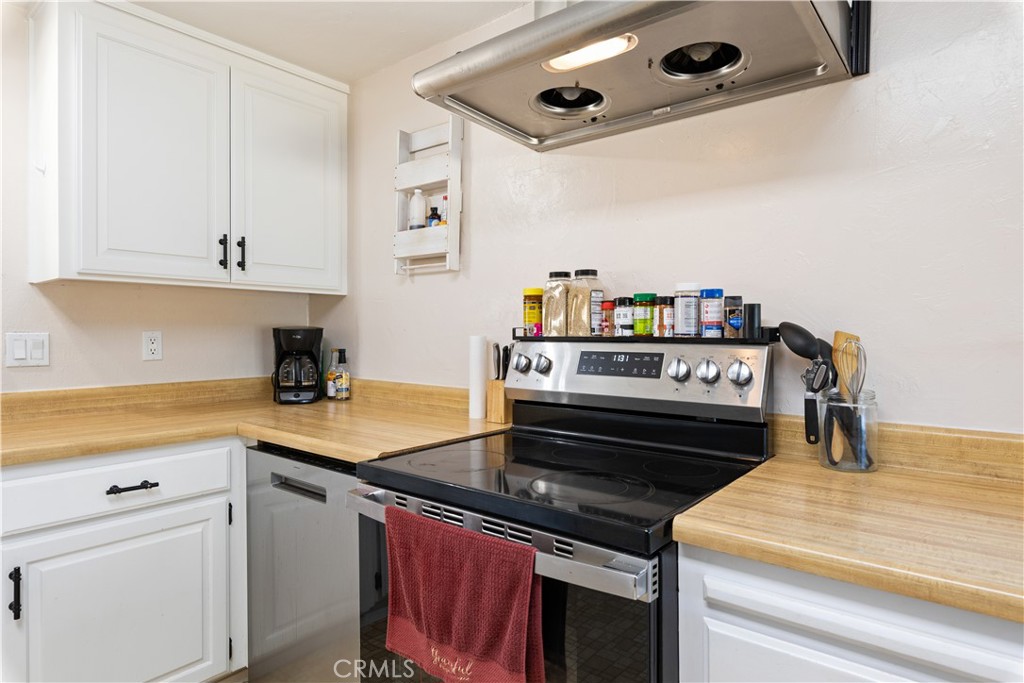 2225 Ladder Ridge Road Upper Lake, CA 95485 - Photo 14 of 58 a kitchen with a stove and a white cabinets