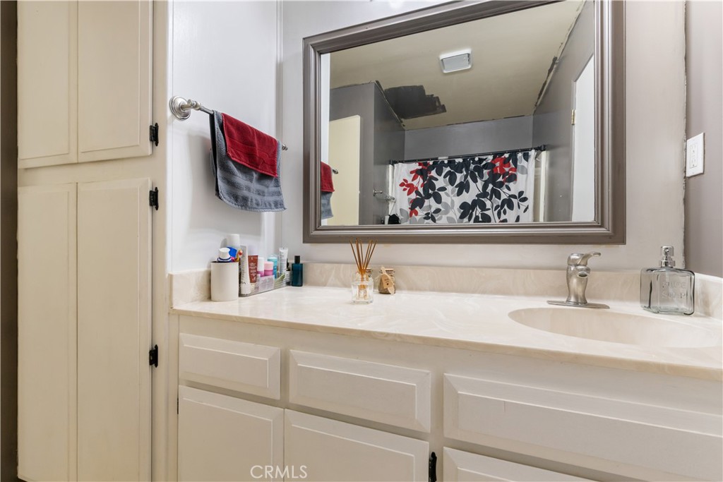 2225 Ladder Ridge Road Upper Lake, CA 95485 - Photo 17 of 58 a bathroom with a sink and a mirror