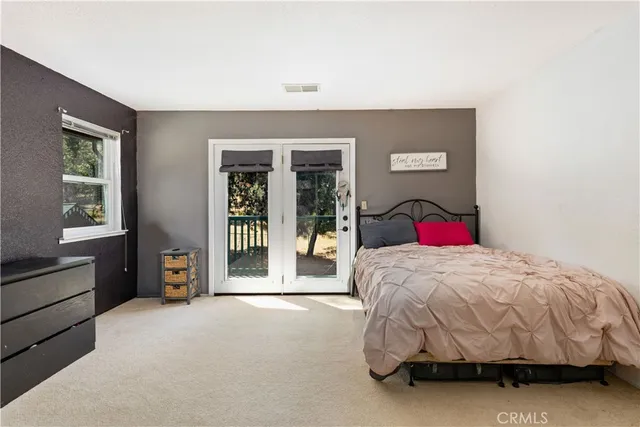 a bathroom with a sink double vanity and a mirror