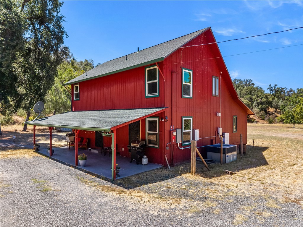 2225 Ladder Ridge Road Upper Lake, CA 95485 - Photo 3 of 58 a view of a house with a yard chairs and table in the patio