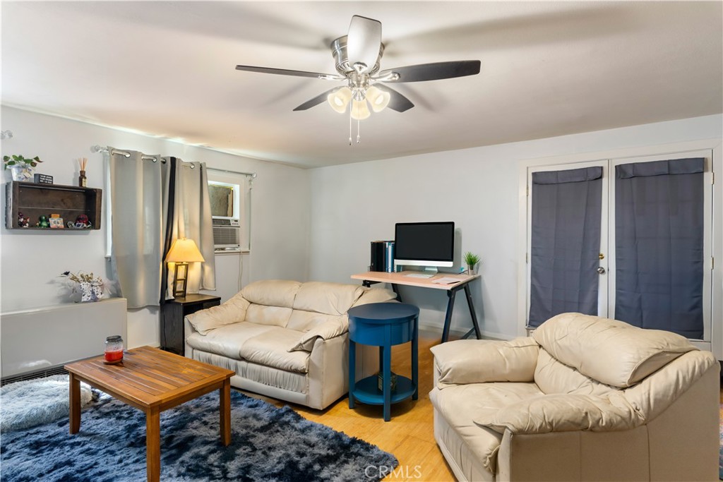 2225 Ladder Ridge Road Upper Lake, CA 95485 - Photo 33 of 58 a living room with furniture a ceiling fan and a window