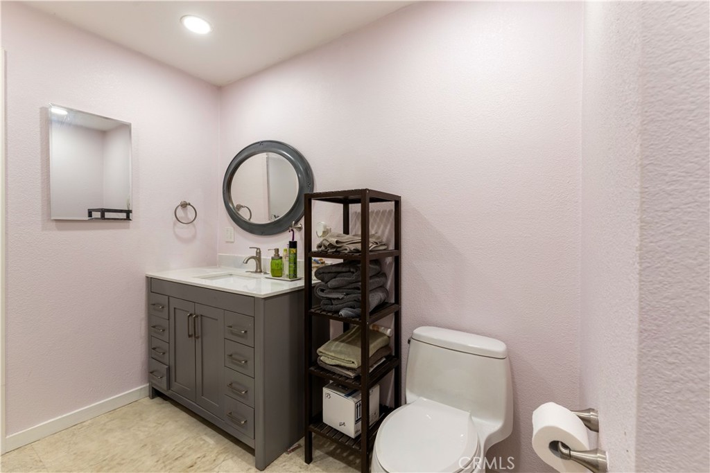 2225 Ladder Ridge Road Upper Lake, CA 95485 - Photo 37 of 58 a bathroom with a toilet a sink and a mirror