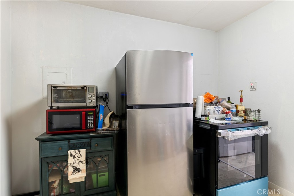 2225 Ladder Ridge Road Upper Lake, CA 95485 - Photo 38 of 58 a kitchen with a refrigerator and a stove top oven