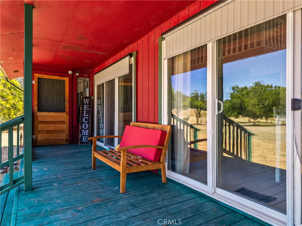 2225 Ladder Ridge Road Upper Lake, CA 95485 - Photo 58 of 58 a patio with lawn chairs and wooden floor