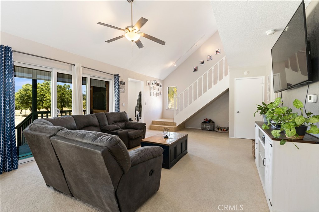 2225 Ladder Ridge Road Upper Lake, CA 95485 - Photo 8 of 58 a living room with furniture ceiling fan and a flat screen tv
