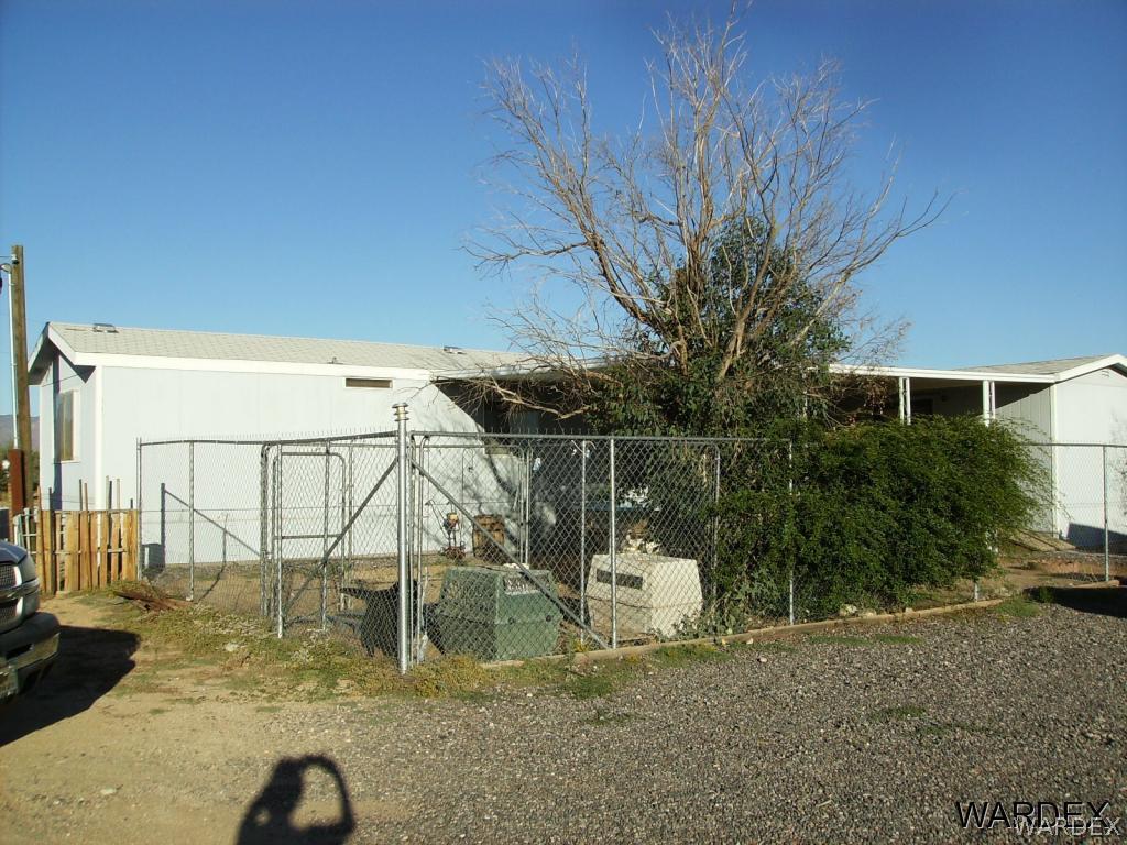 5245 Concho Road Golden Valley, AZ 86413 - Photo 3 of 26 a backyard of a house with table and chairs