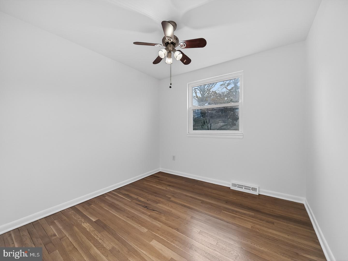 3108 P Street Southeast Washington, DC 20020 - Photo 12 of 34 Light-filled bedroom featuring a ceiling fan.