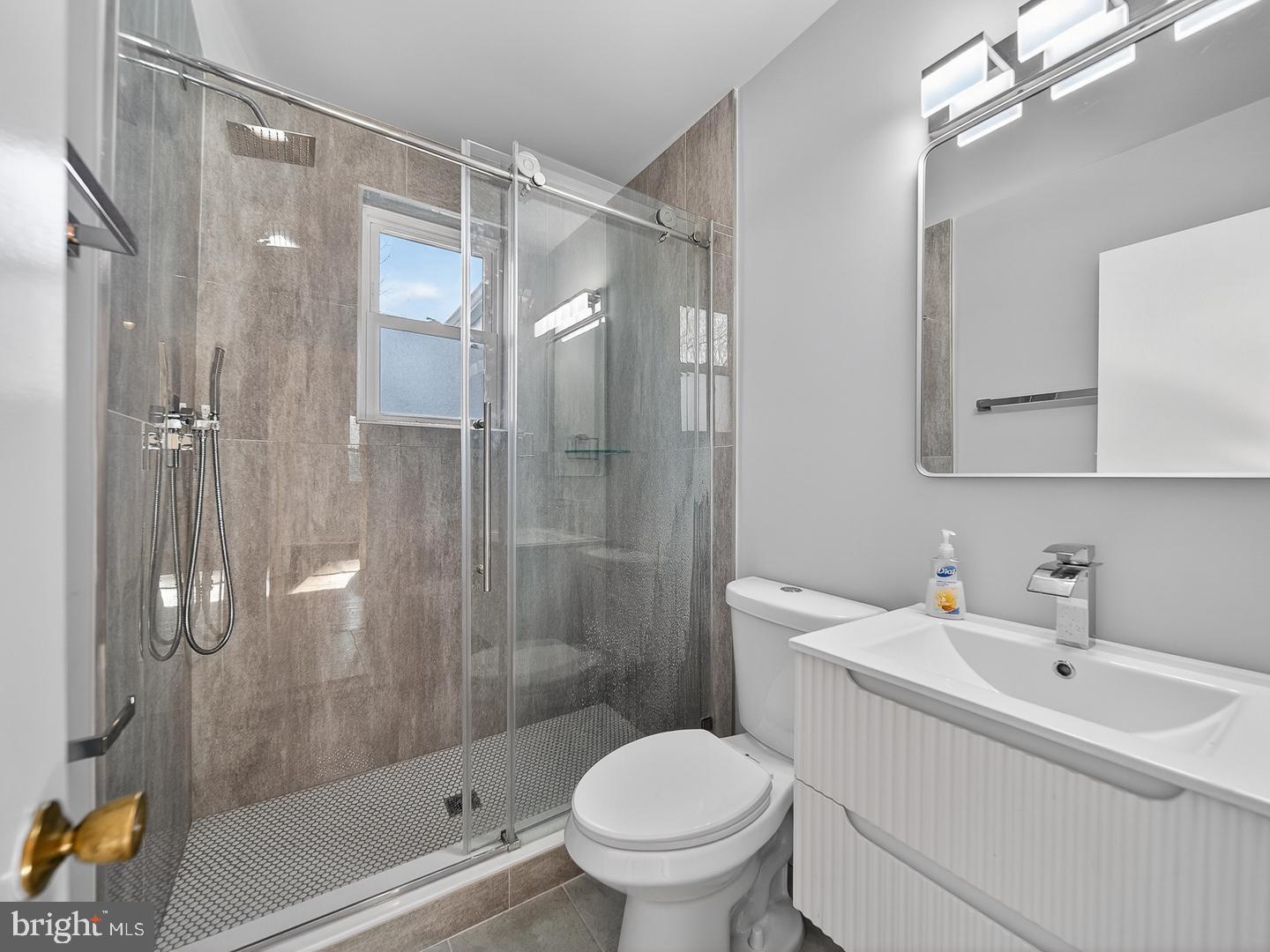 3108 P Street Southeast Washington, DC 20020 - Photo 14 of 34 Modern bathroom with sleek glass shower.