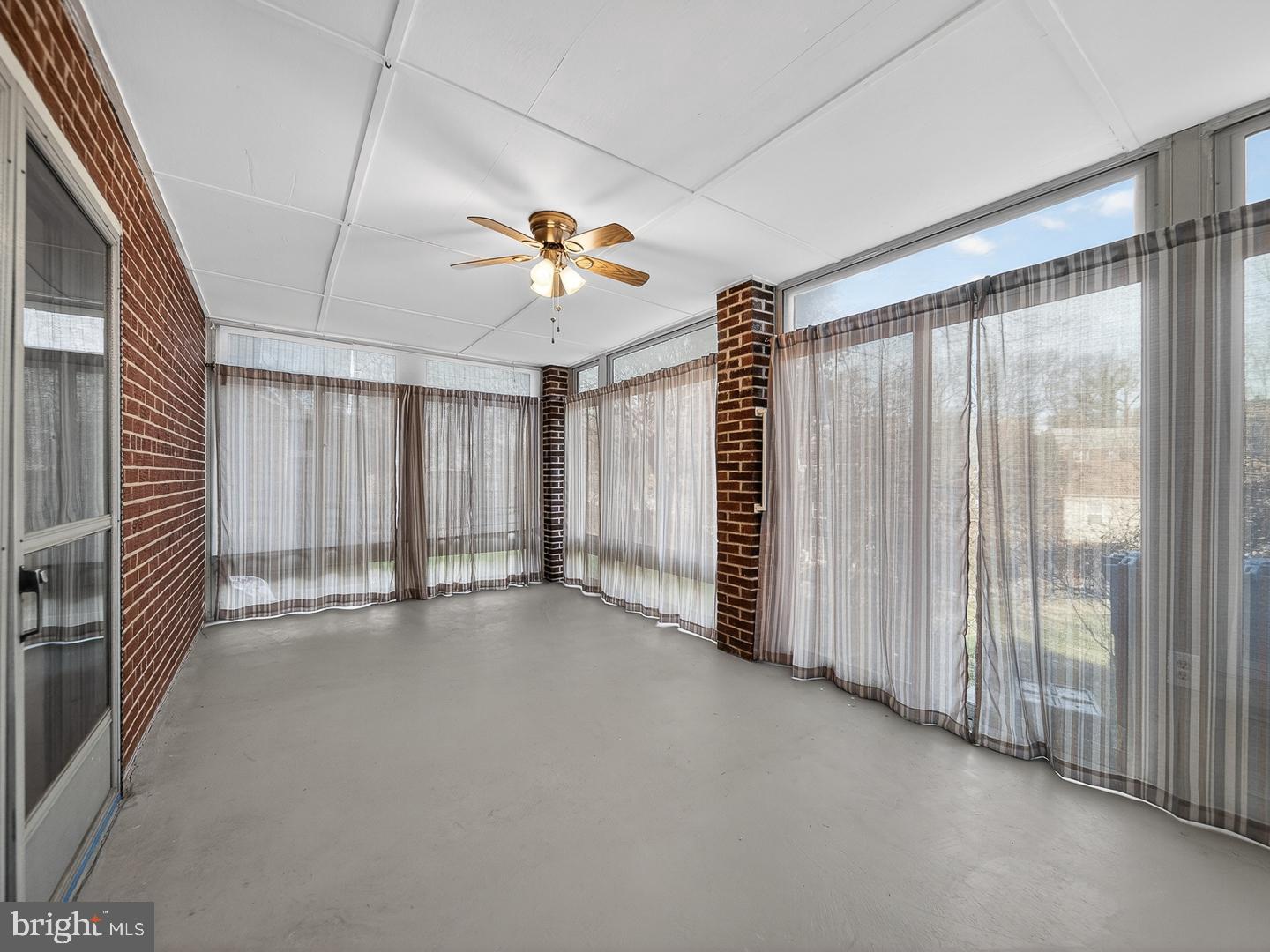 3108 P Street Southeast Washington, DC 20020 - Photo 26 of 34 Spacious sunroom with three walls of window.