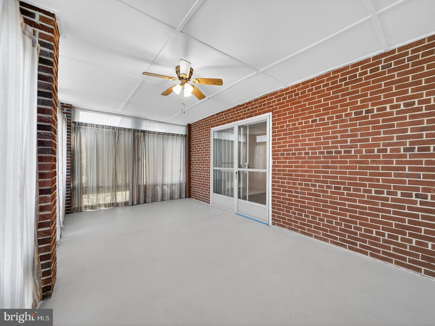3108 P Street Southeast Washington, DC 20020 - Photo 28 of 34 Sunroom with brick accents.