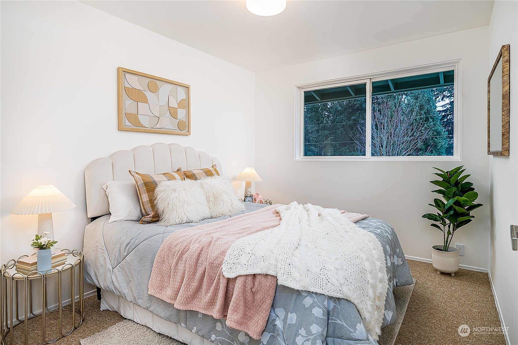 5 234th Place Southeast Bothell, WA 98021 - Photo 11 of 22 a bedroom with a bed and a potted plant