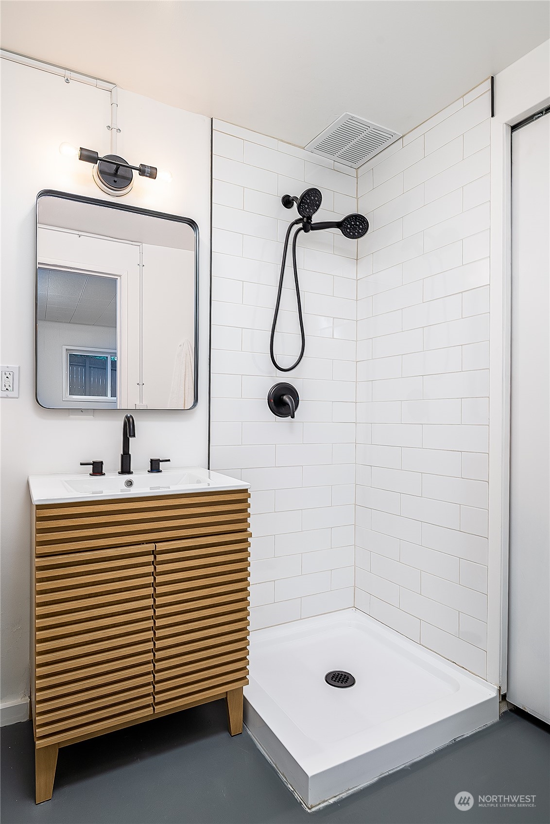 5 234th Place Southeast Bothell, WA 98021 - Photo 14 of 22 a bathroom with a sink a mirror and a shower