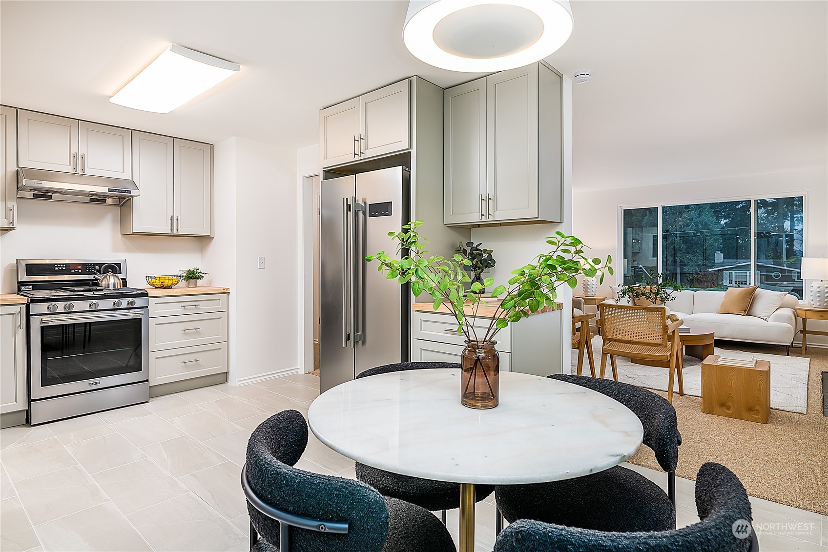5 234th Place Southeast Bothell, WA 98021 - Photo 5 of 22 a kitchen with a table and chairs
