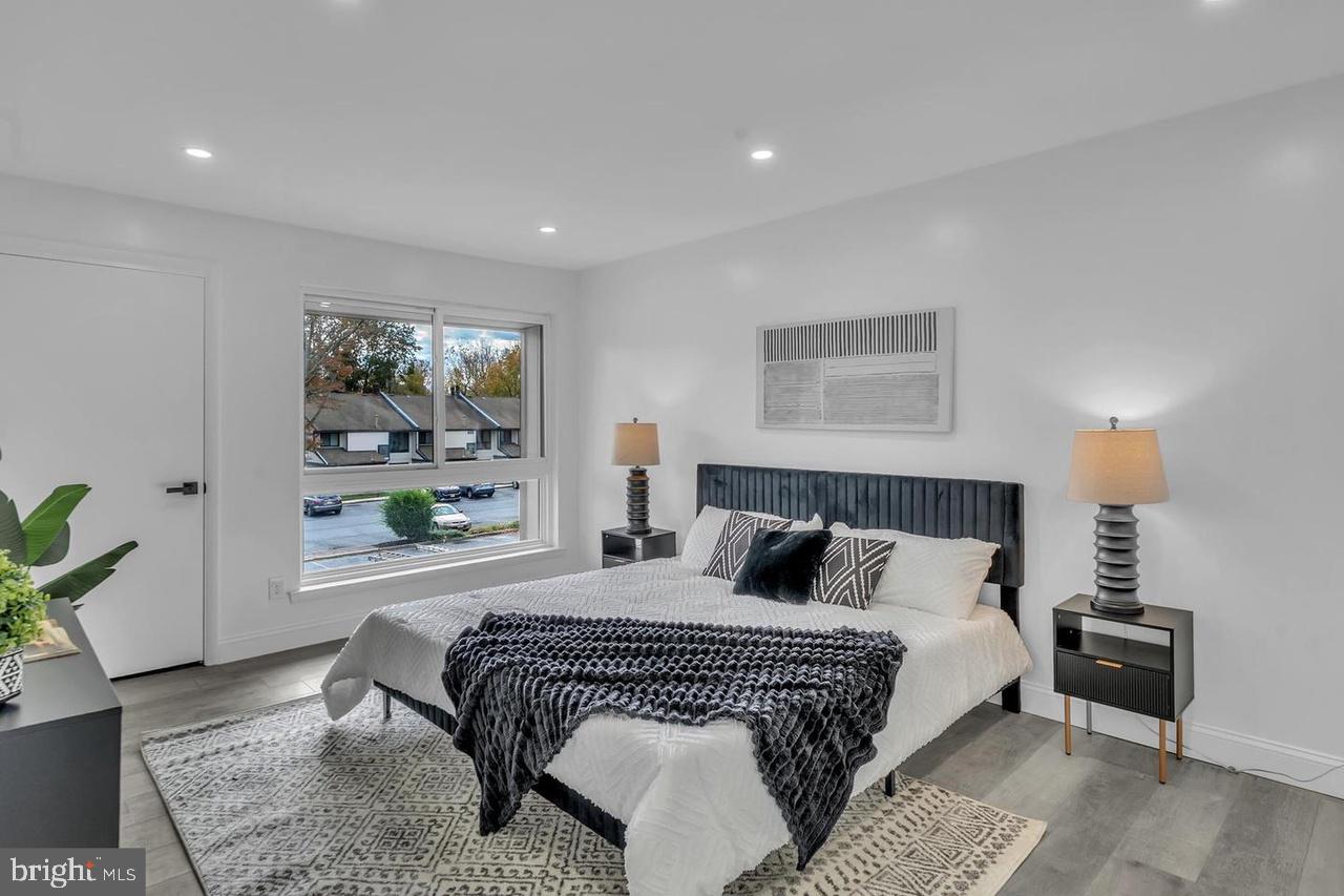 201 Timber Creek Road Lindenwold, NJ 08021 - Photo 11 of 38 a bedroom with a large bed and a couch