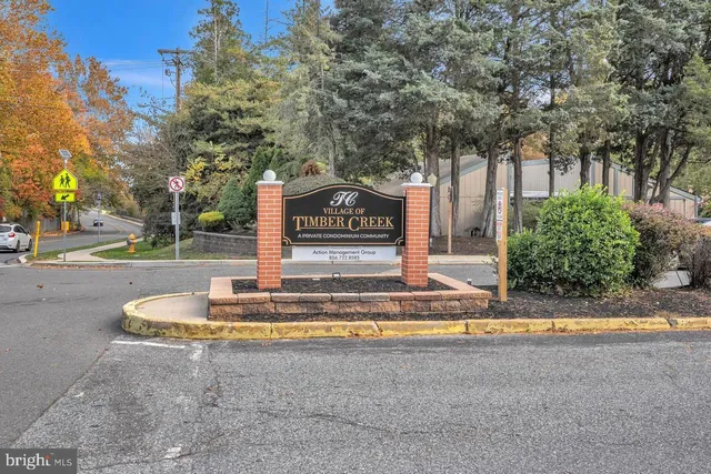 a view of a house with a yard and tree s