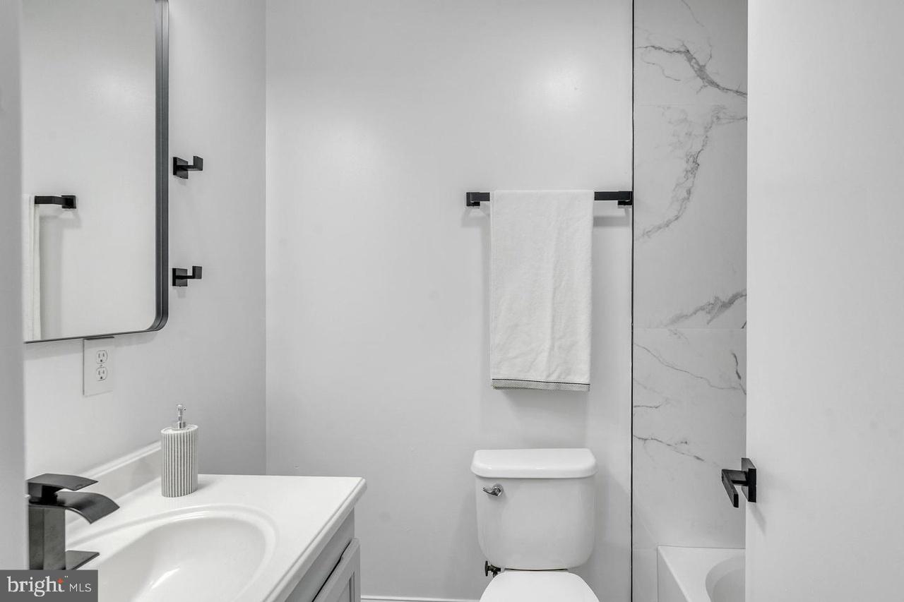 201 Timber Creek Road Lindenwold, NJ 08021 - Photo 21 of 38 a bathroom with a sink toilet and vanity