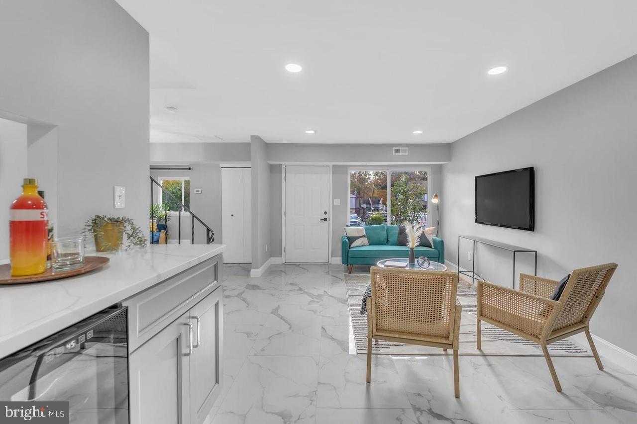 201 Timber Creek Road Lindenwold, NJ 08021 - Photo 25 of 38 a living room with furniture a flat screen tv and a window