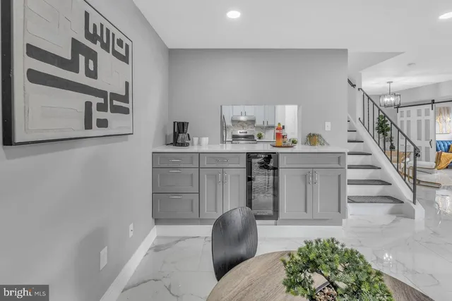 a sink with white cabinets