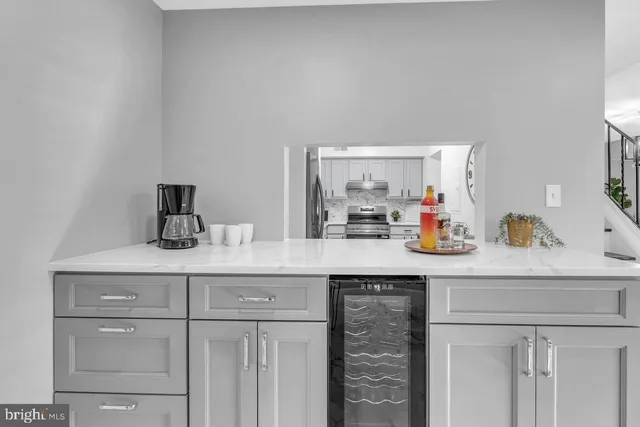 a living room with dining table and a window