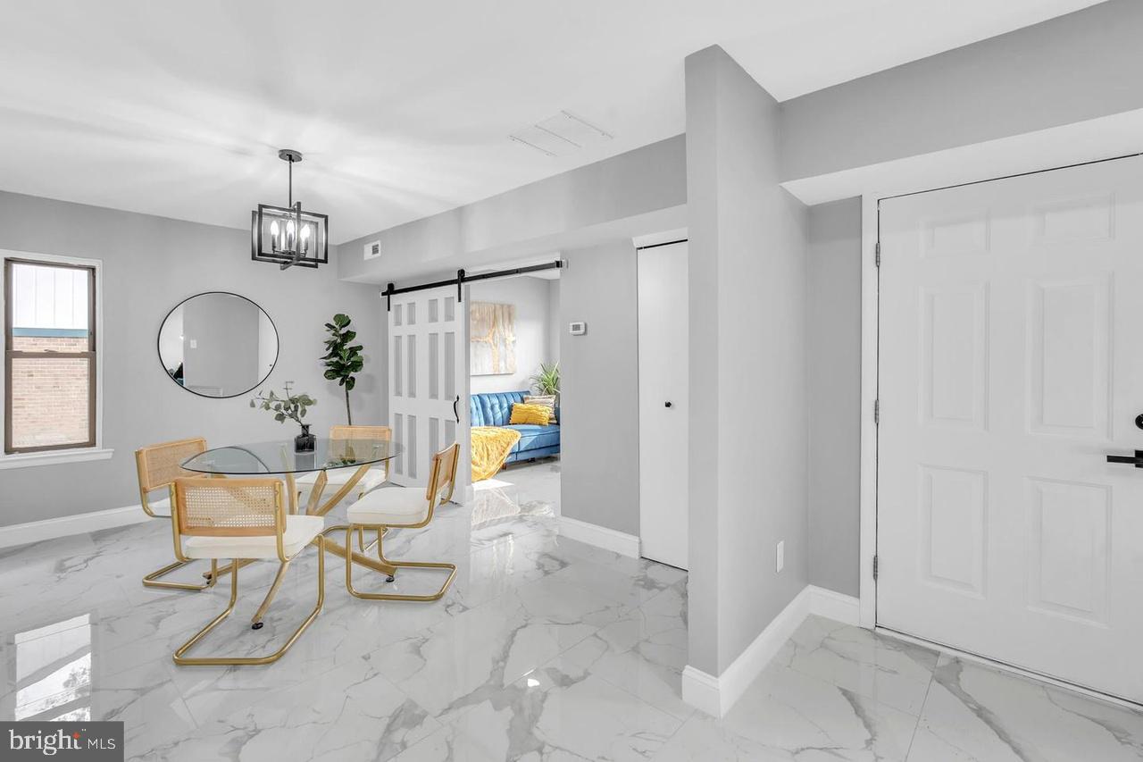 201 Timber Creek Road Lindenwold, NJ 08021 - Photo 30 of 38 a living room with dining table and a window