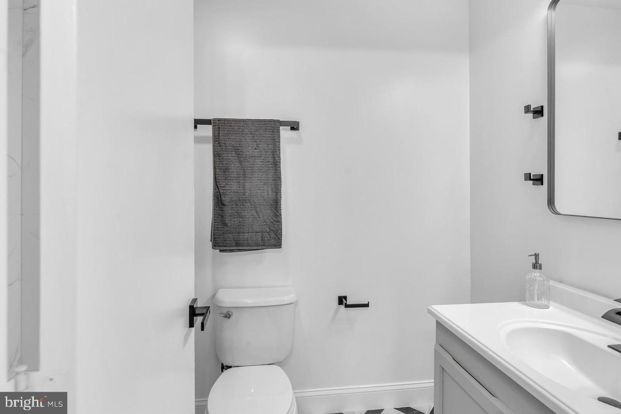 201 Timber Creek Road Lindenwold, NJ 08021 - Photo 3 of 38 a bathroom with a sink toilet and vanity