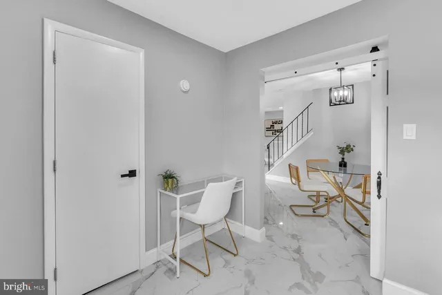 a view of a bedroom with a bed and furniture