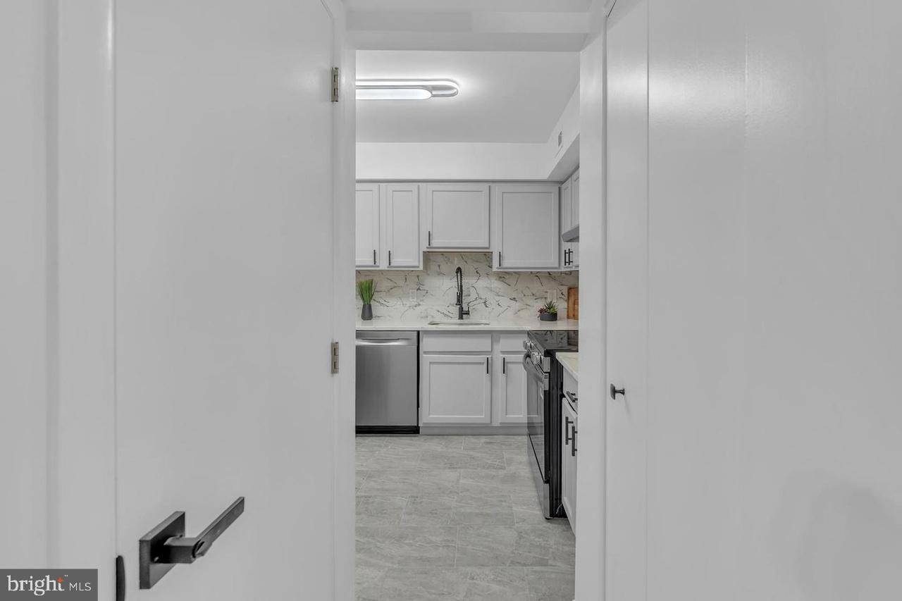 201 Timber Creek Road Lindenwold, NJ 08021 - Photo 34 of 38 a view of a kitchen with white cabinets and wooden floor