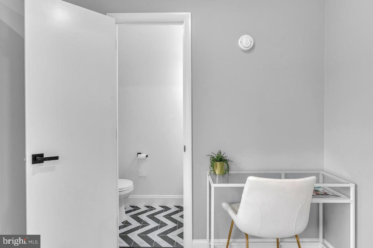 201 Timber Creek Road Lindenwold, NJ 08021 - Photo 6 of 38 a view of a room with a potted plant on a table and chair