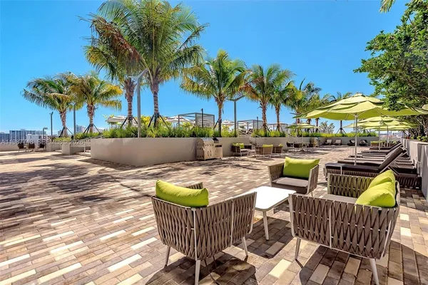 a view of outdoor space with patio furniture and swimming pool