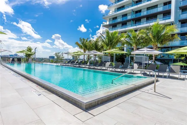 a view of a swimming pool with a patio