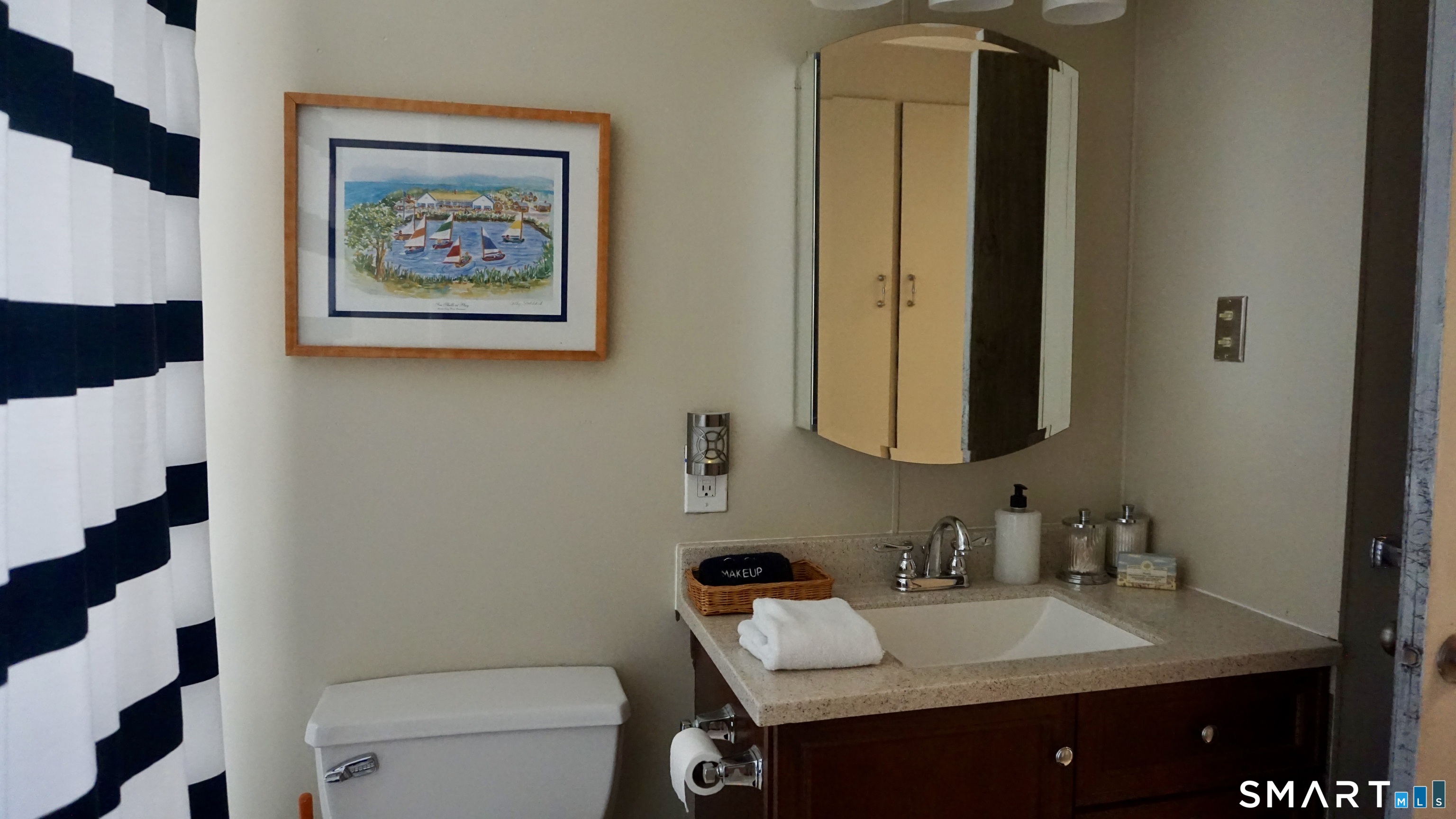 13 Pacific Street Groton, CT 06340 - Photo 30 of 31 a bathroom with a granite countertop sink and a mirror