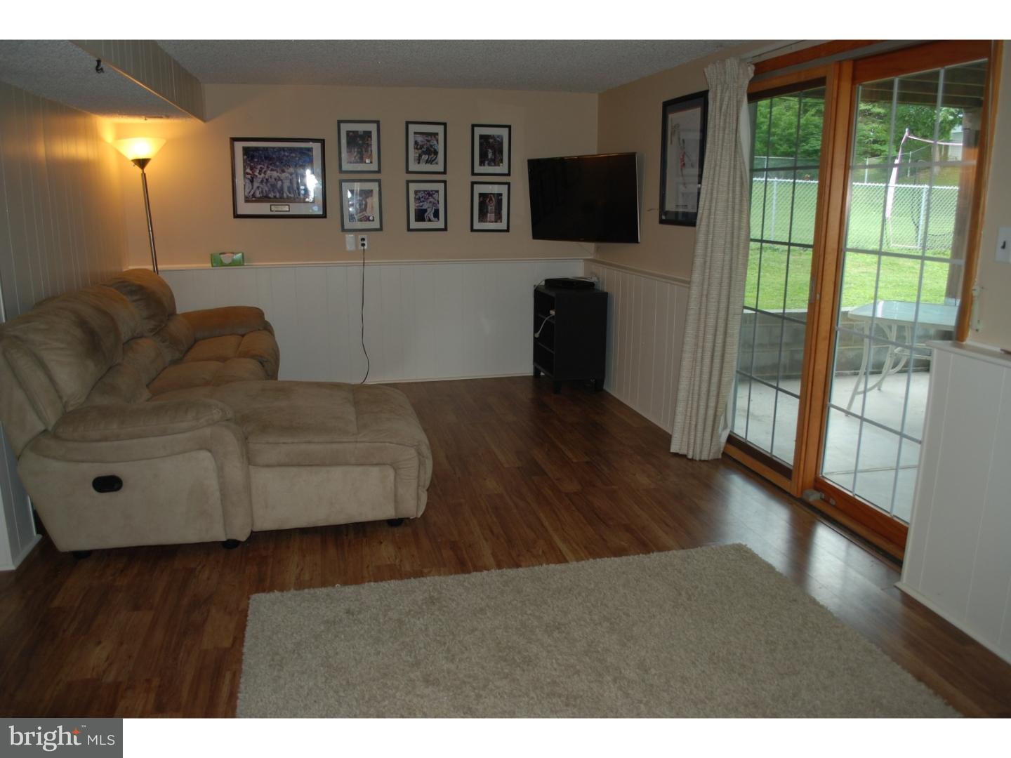 22 Hearthside Road Aston, PA 19014 - Photo 14 of 22 a living room with furniture and a flat screen tv
